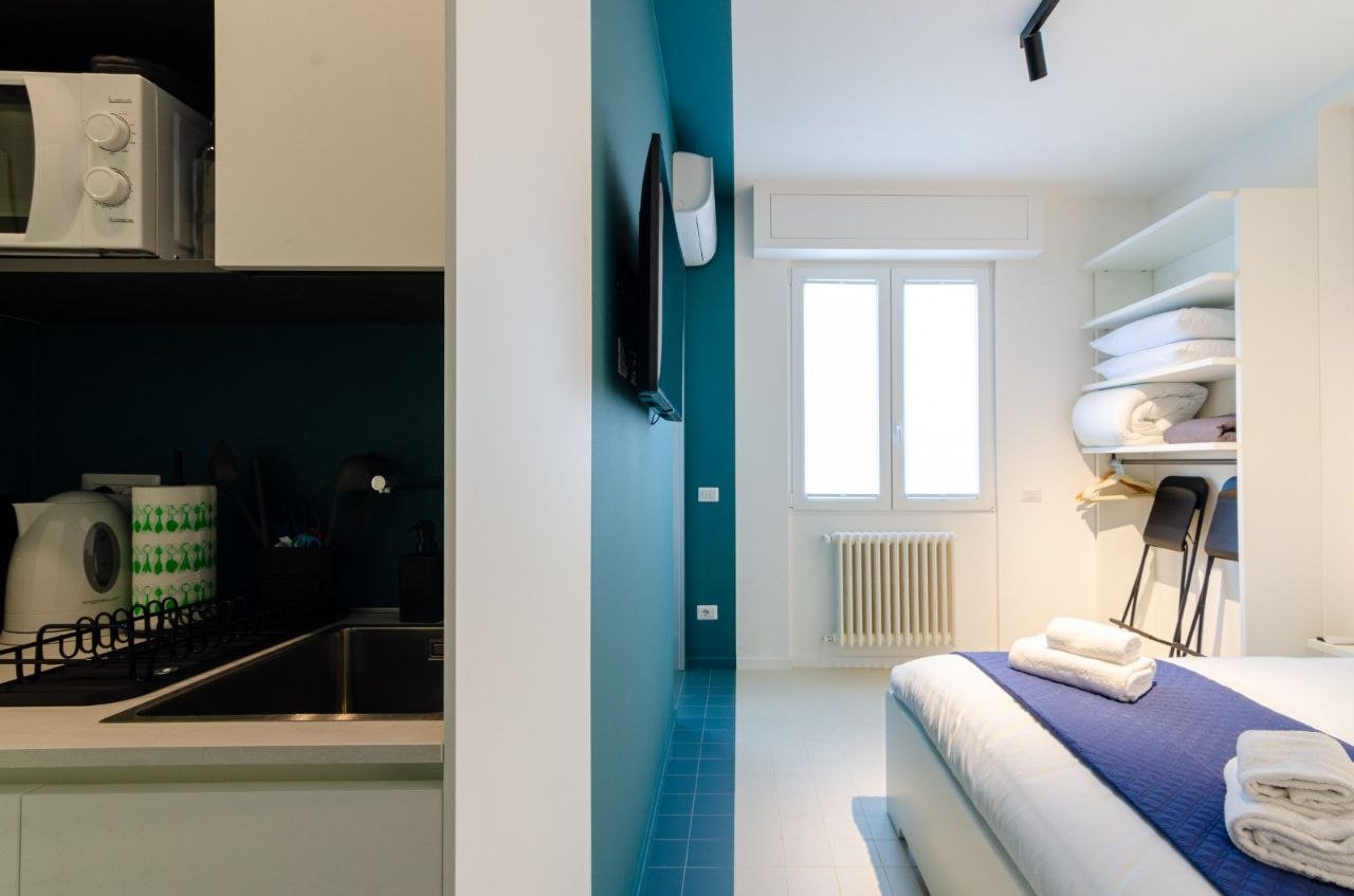 Kitchenette connecting bedroom to living room