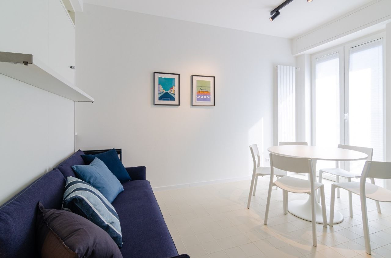 San Siro Blue Flat — Modern living room with blue sofa