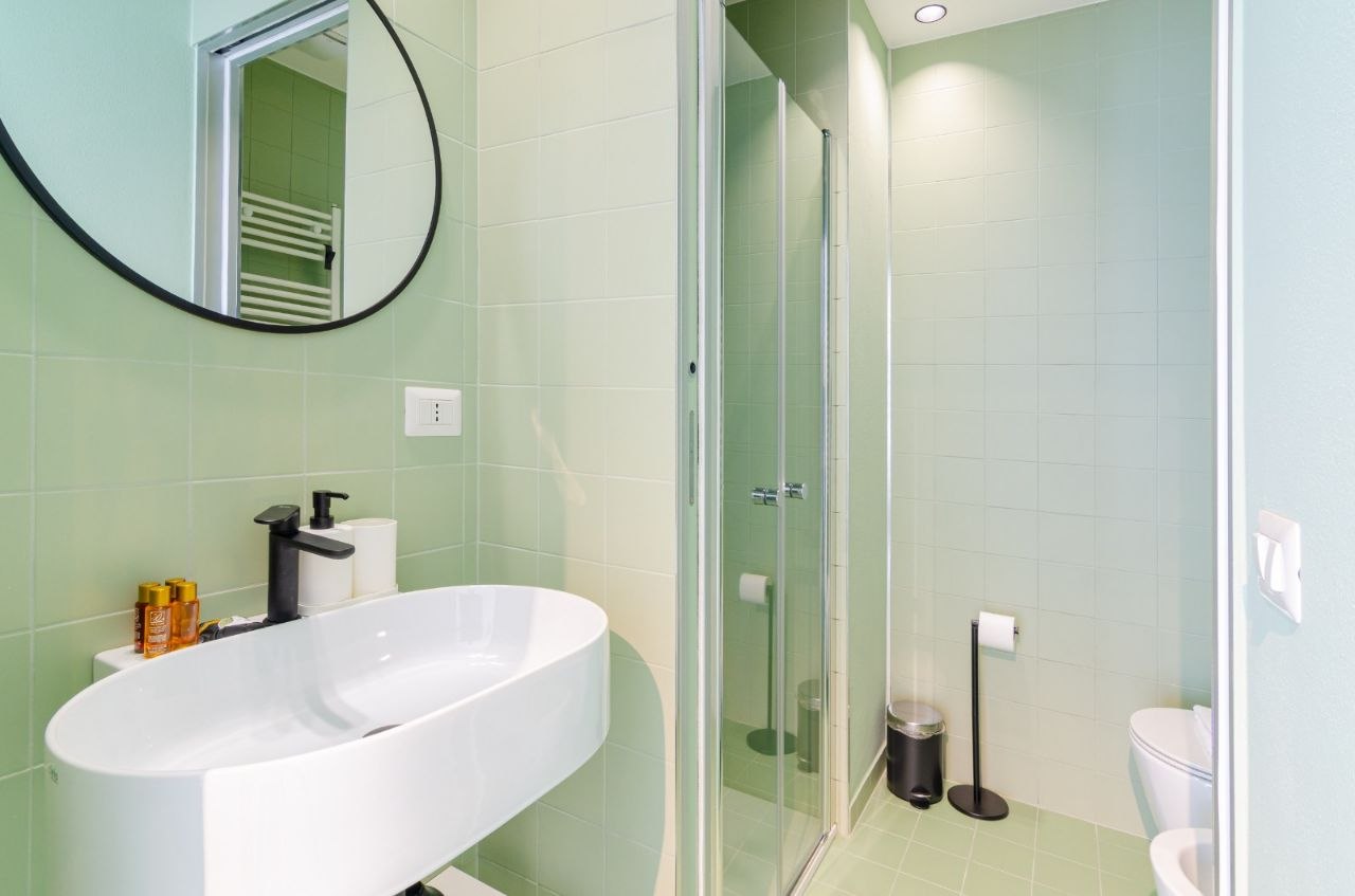 Second bathroom with sink and shower