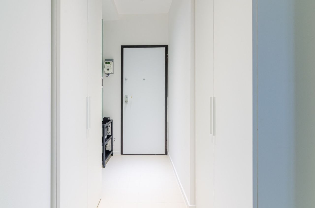 Entrance hallway with wardrobes and security door