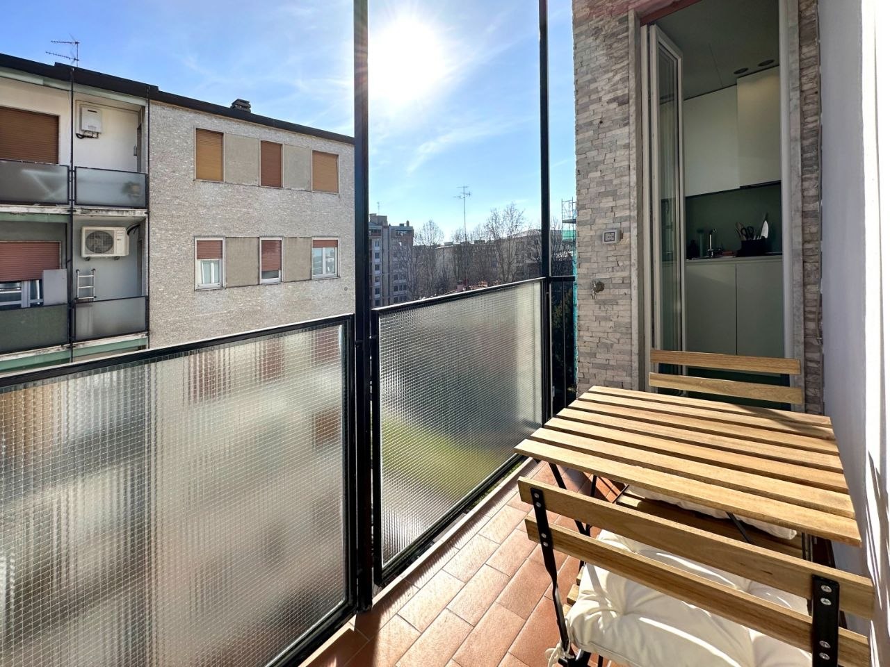 Sunny balcony with small table